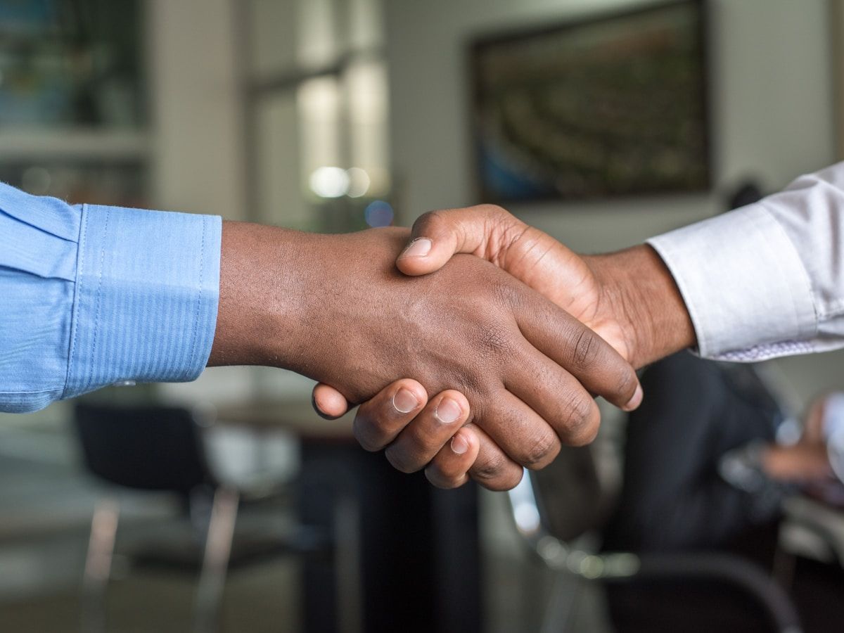 Business partners shaking hands after an agreement